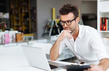 Student working on laptop in library