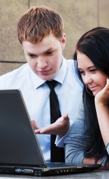 Young couple with laptop.