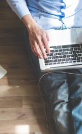 elegant business multitasking multimedia man using devices at home